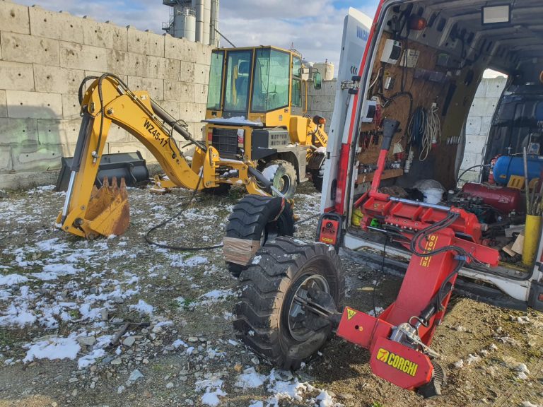 Duba de vulcanizare mobila langa un excavator, iarna
